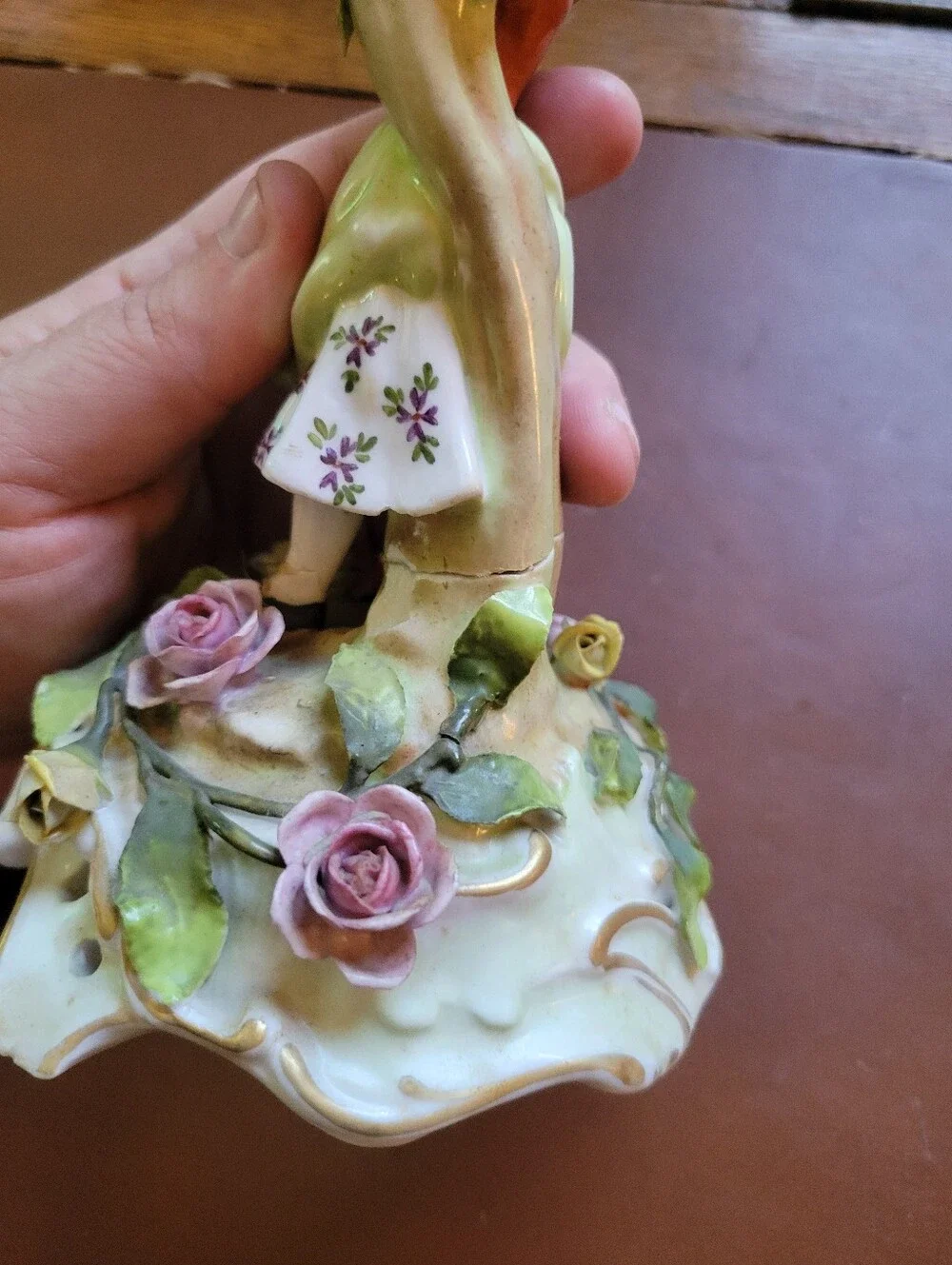 antique porcelain figurine, likely German from around 1900-repaired